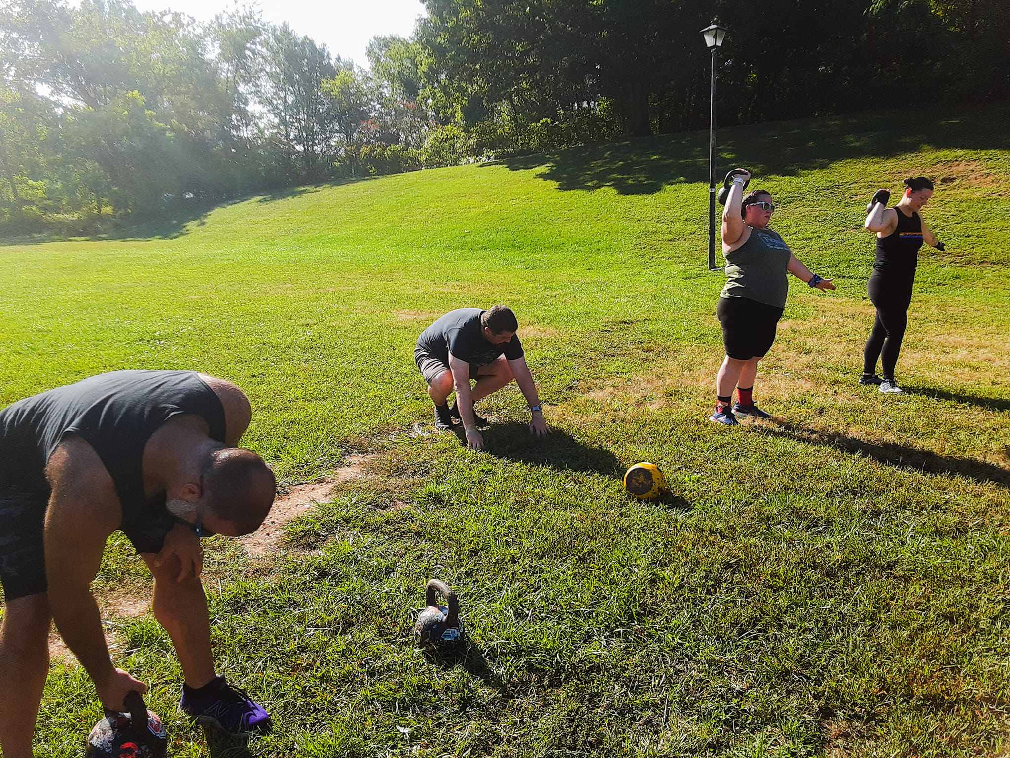 Marcus Lawrence training a group of clients outdoors